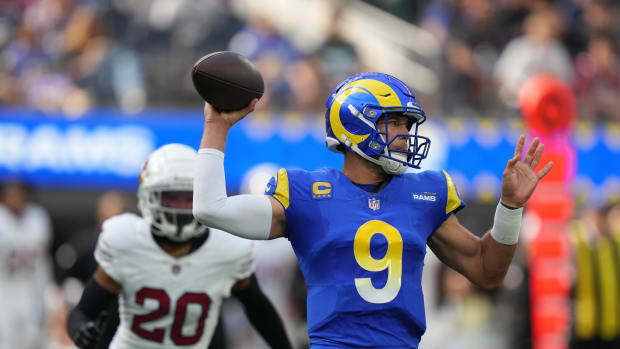 October 15, 2023; Inglewood, California, USA; Los Angeles Rams quarterback Matthew Stafford (9) passes the football against Arizona Cardinals cornerback Marco Wilson (20) during the first quarter at SoFi Stadium. Mandatory Credit: Kyle Terada-USA TODAY Sports